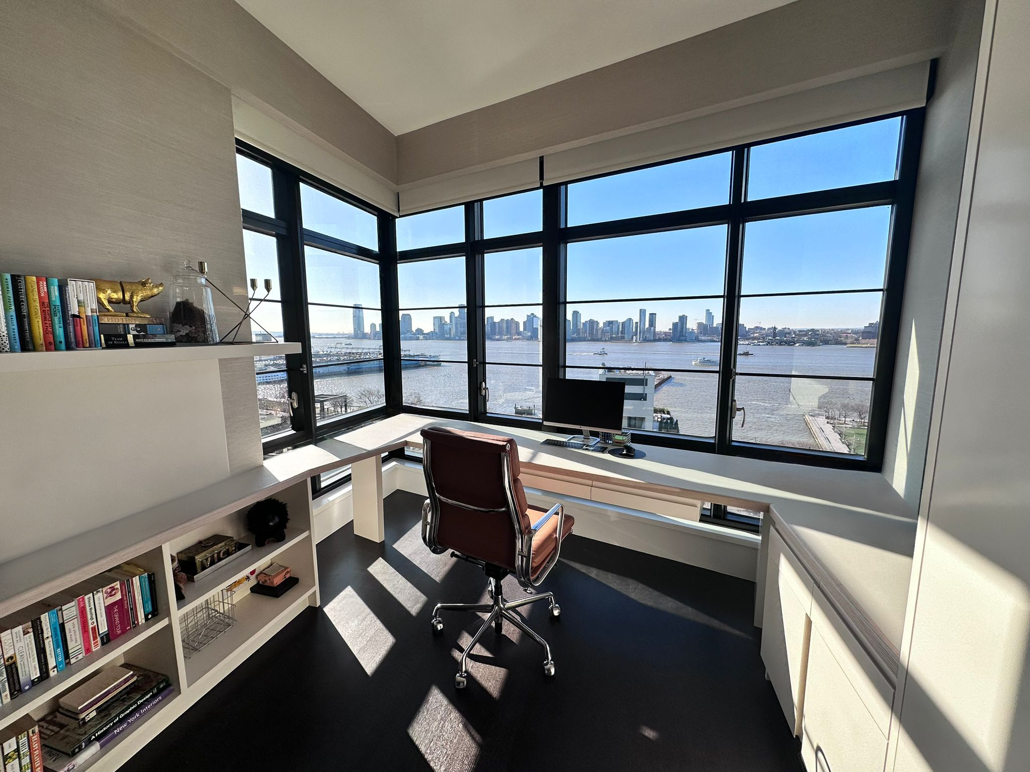 Custom Forbo linoleum desk and bookshelves in West Village renovation