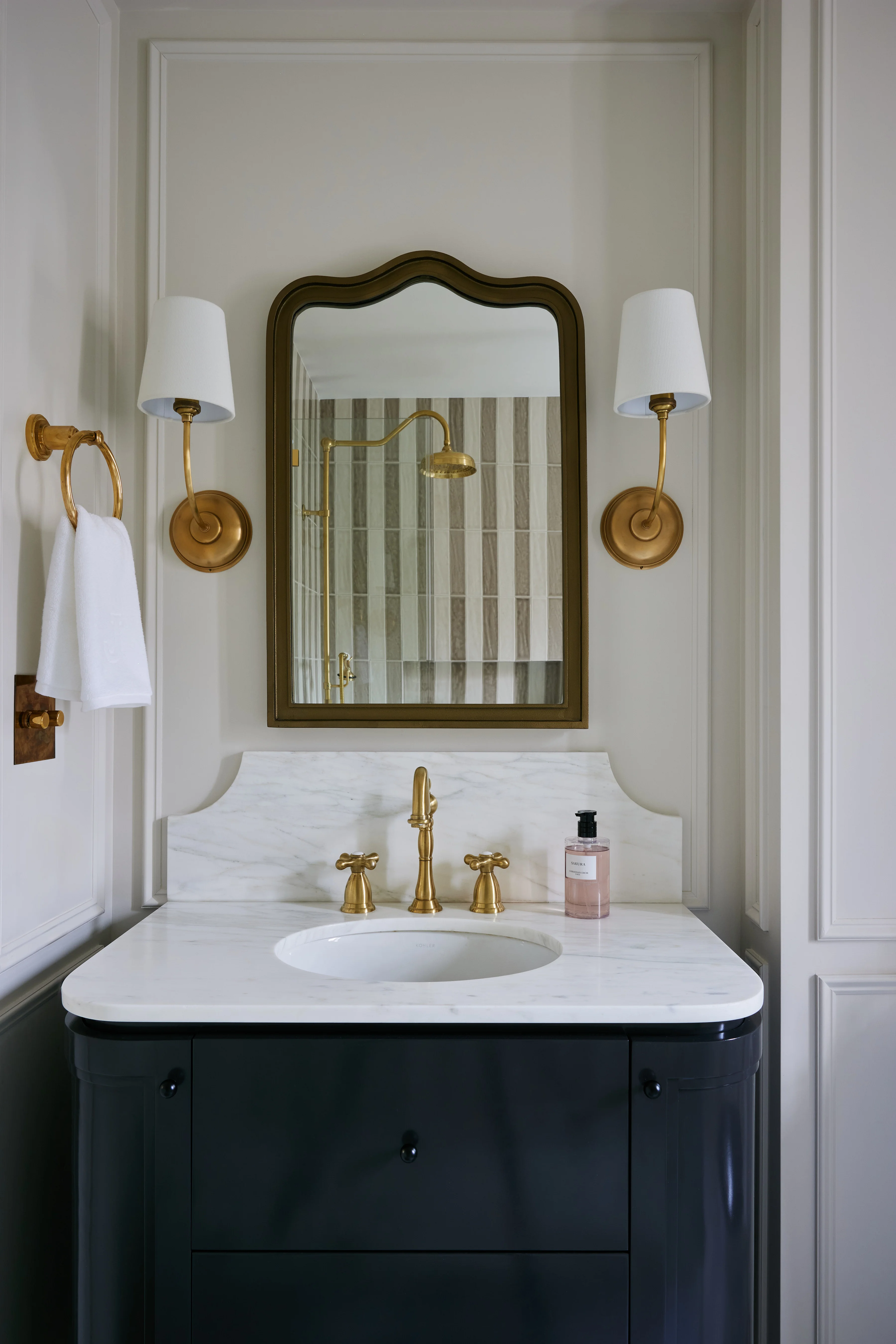 Bathroom with custom tilework and built-in vanity